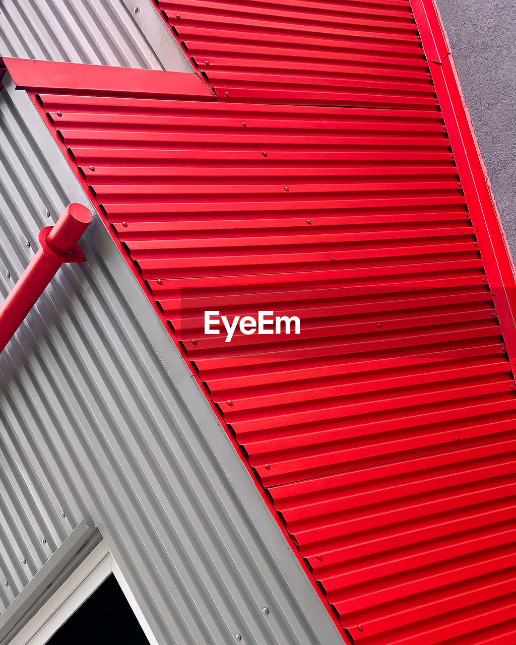 Low angle view of red shutter of building