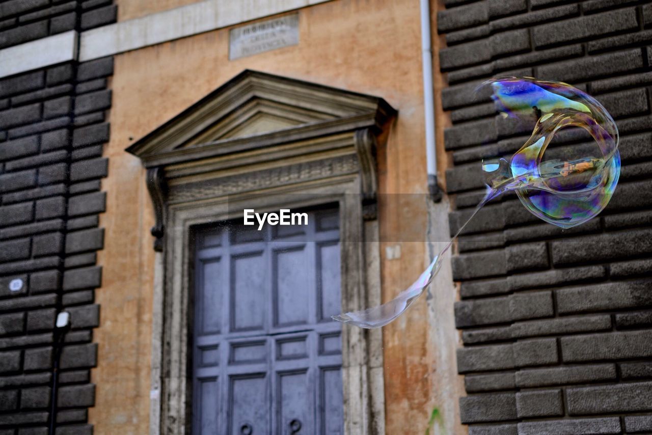 Close-up of bubble near house