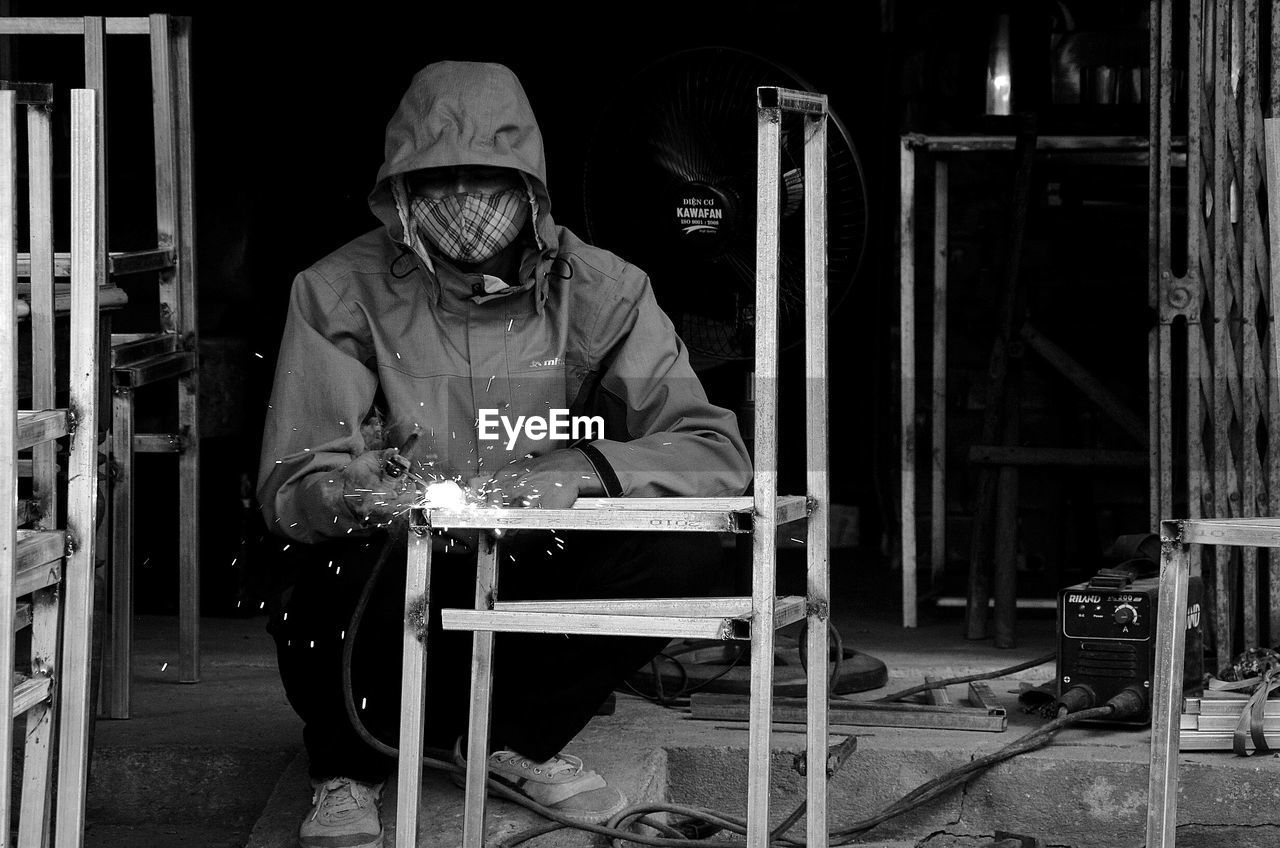 MAN WORKING IN SHOPPING MALL