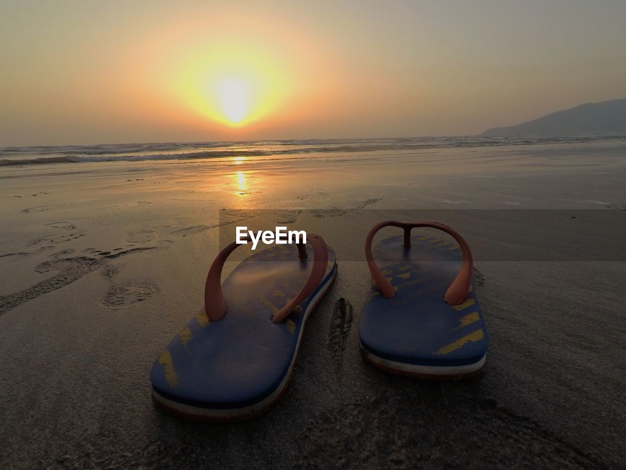 SCENIC VIEW OF BEACH DURING SUNSET