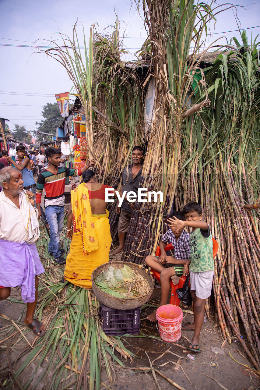 GROUP OF PEOPLE IN MARKET