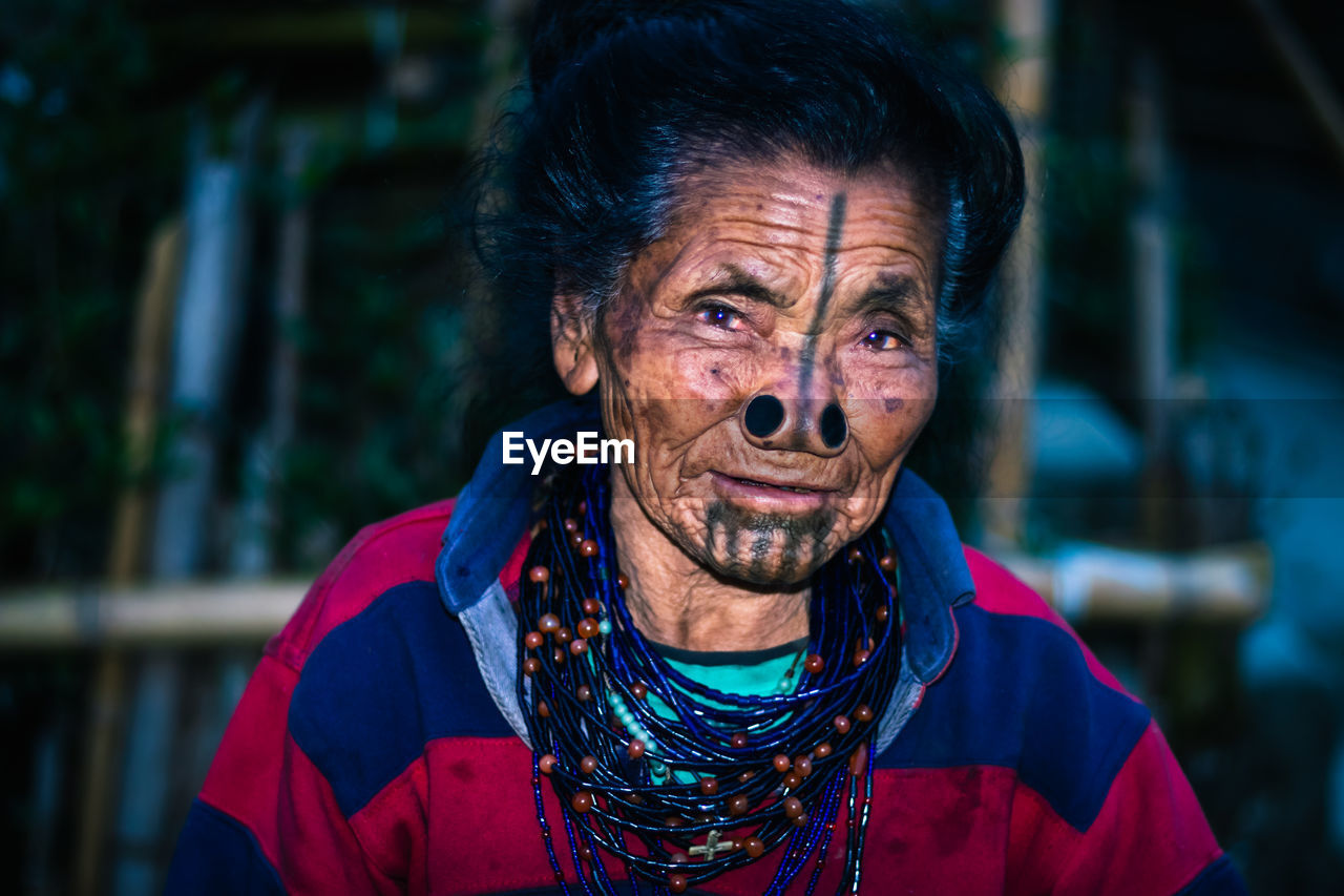 Portrait of smiling senior woman outdoors