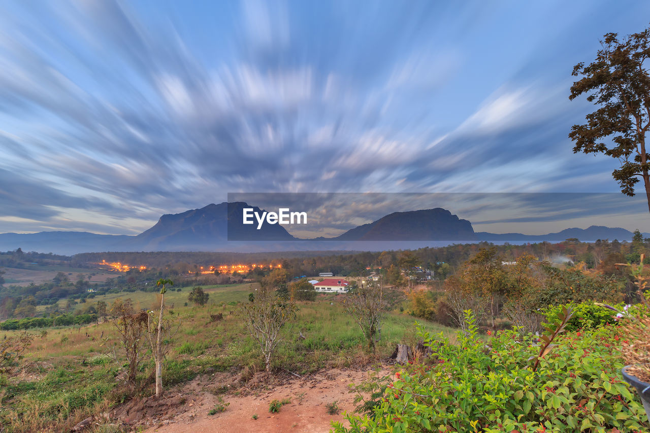 SCENIC VIEW OF LAND AND MOUNTAINS AGAINST SKY