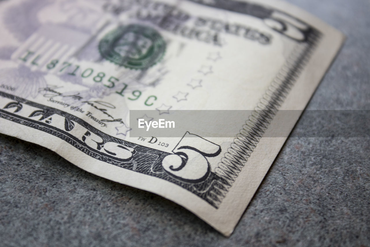 Close-up of paper currency on table