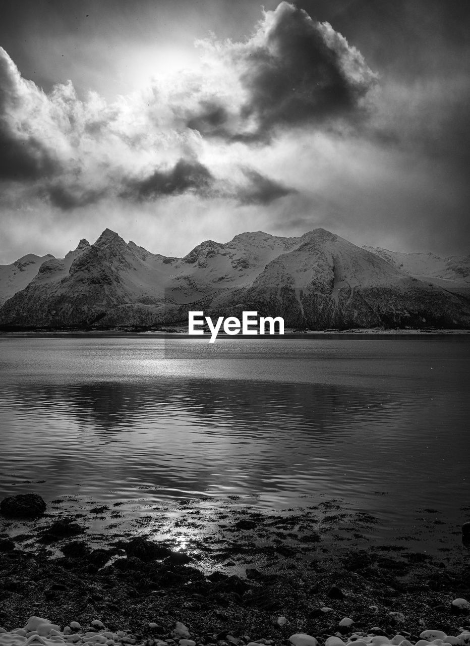 Scenic view of sea against cloudy sky