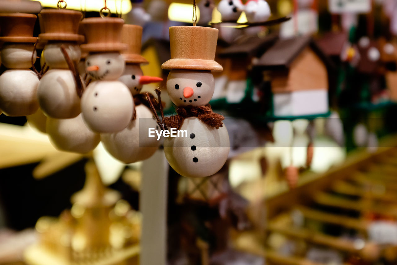 CLOSE-UP OF STUFFED TOY HANGING IN BASKET