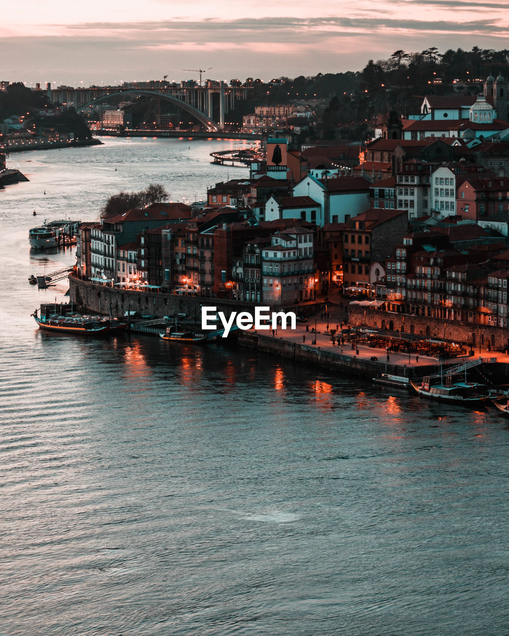 Scenic view of city by sea against sky during sunset porto