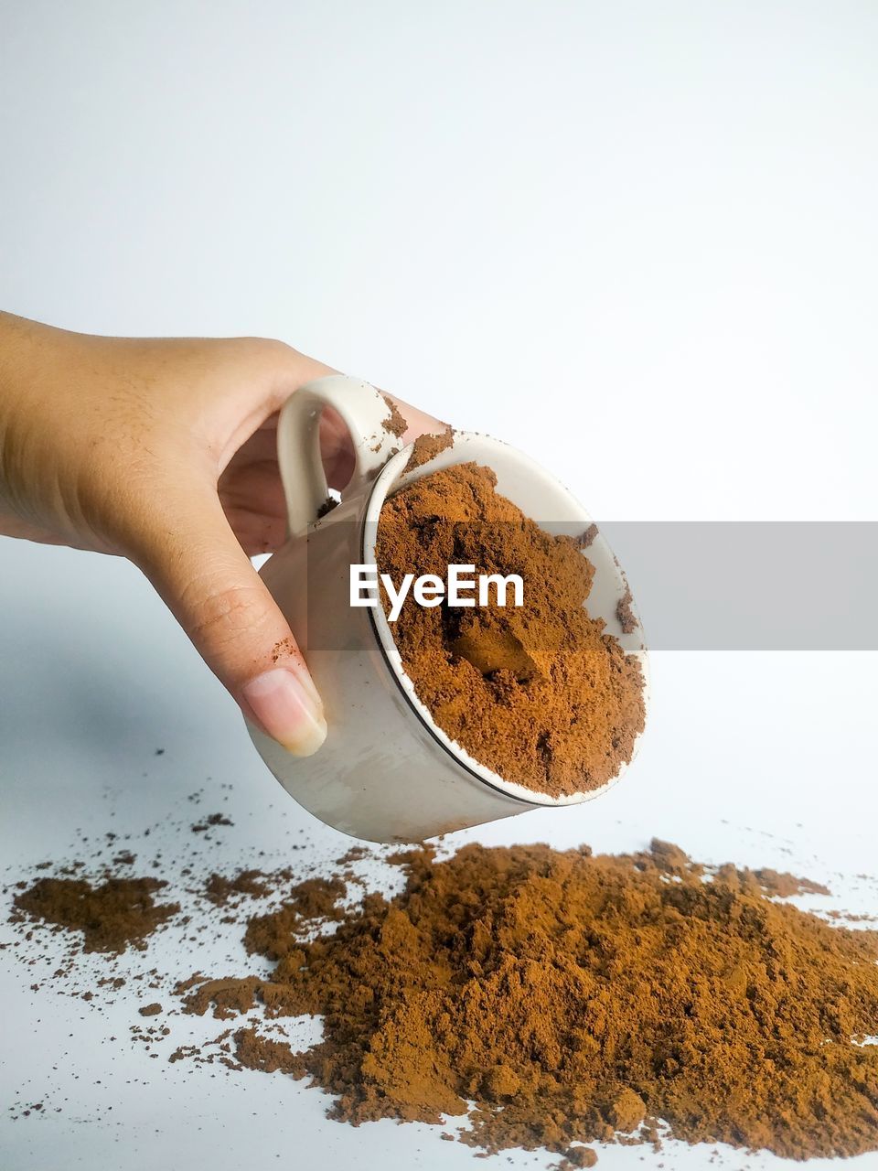 Midsection of person preparing food against white background