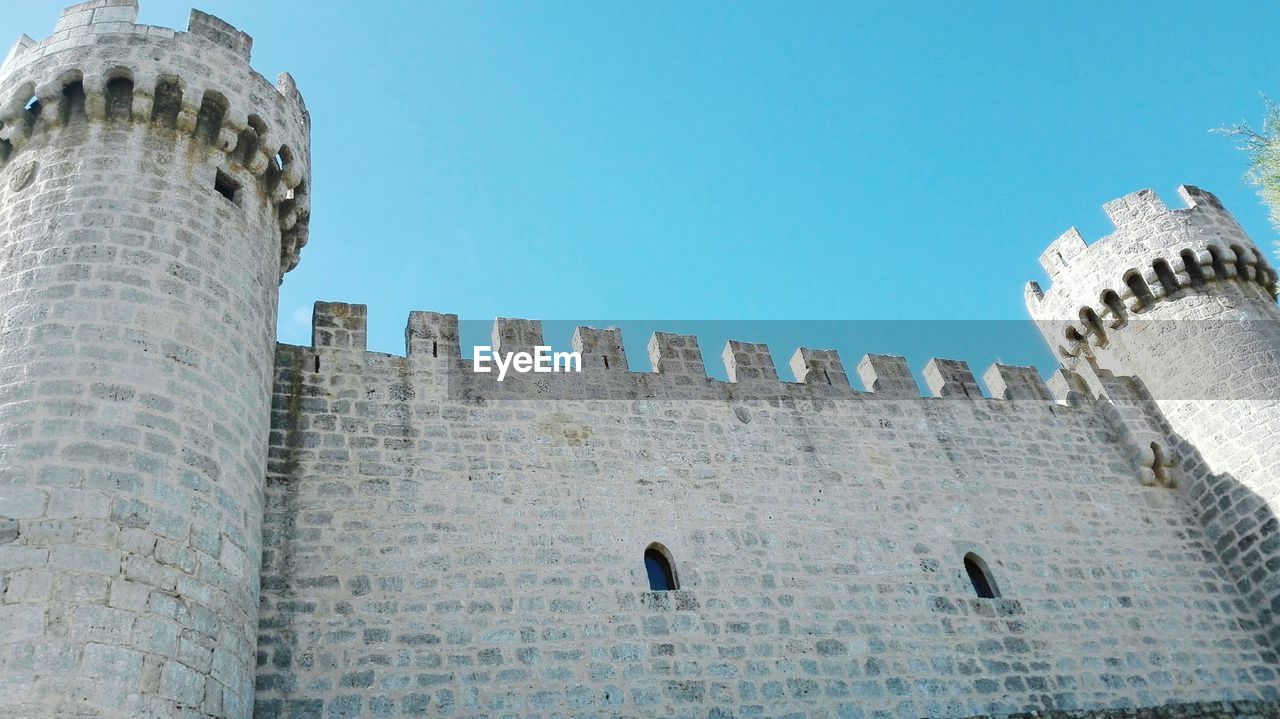 Low angle view of fort against clear sky