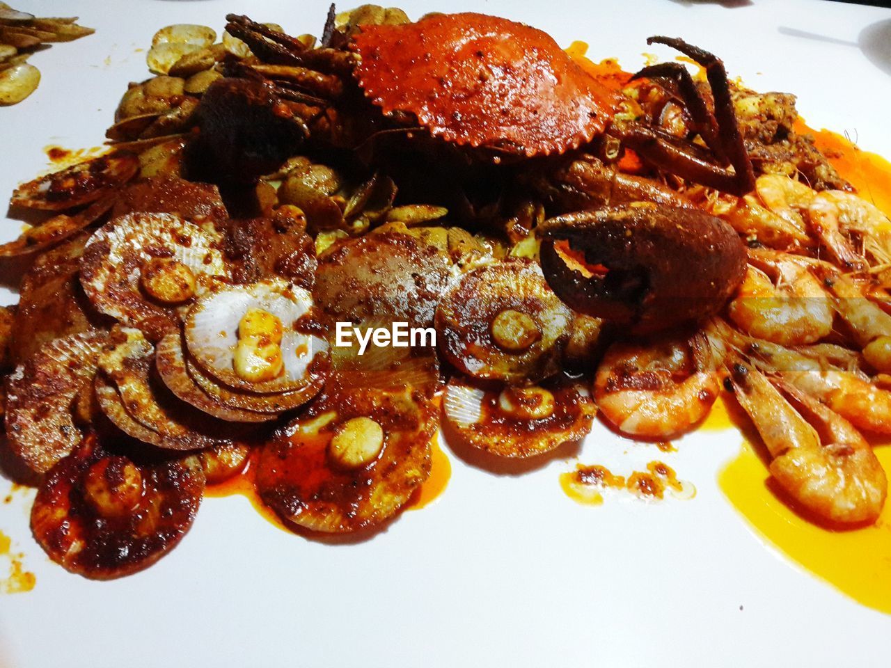 Close-up of crab and prawns served in plate