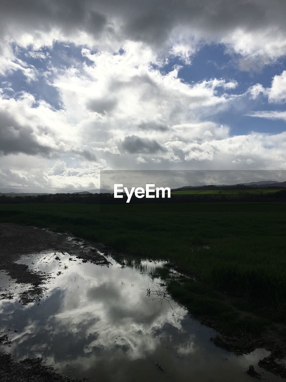 SCENIC VIEW OF LANDSCAPE WITH RIVER IN BACKGROUND