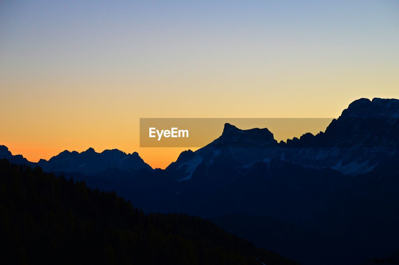 Scenic view of mountains against sky during sunset