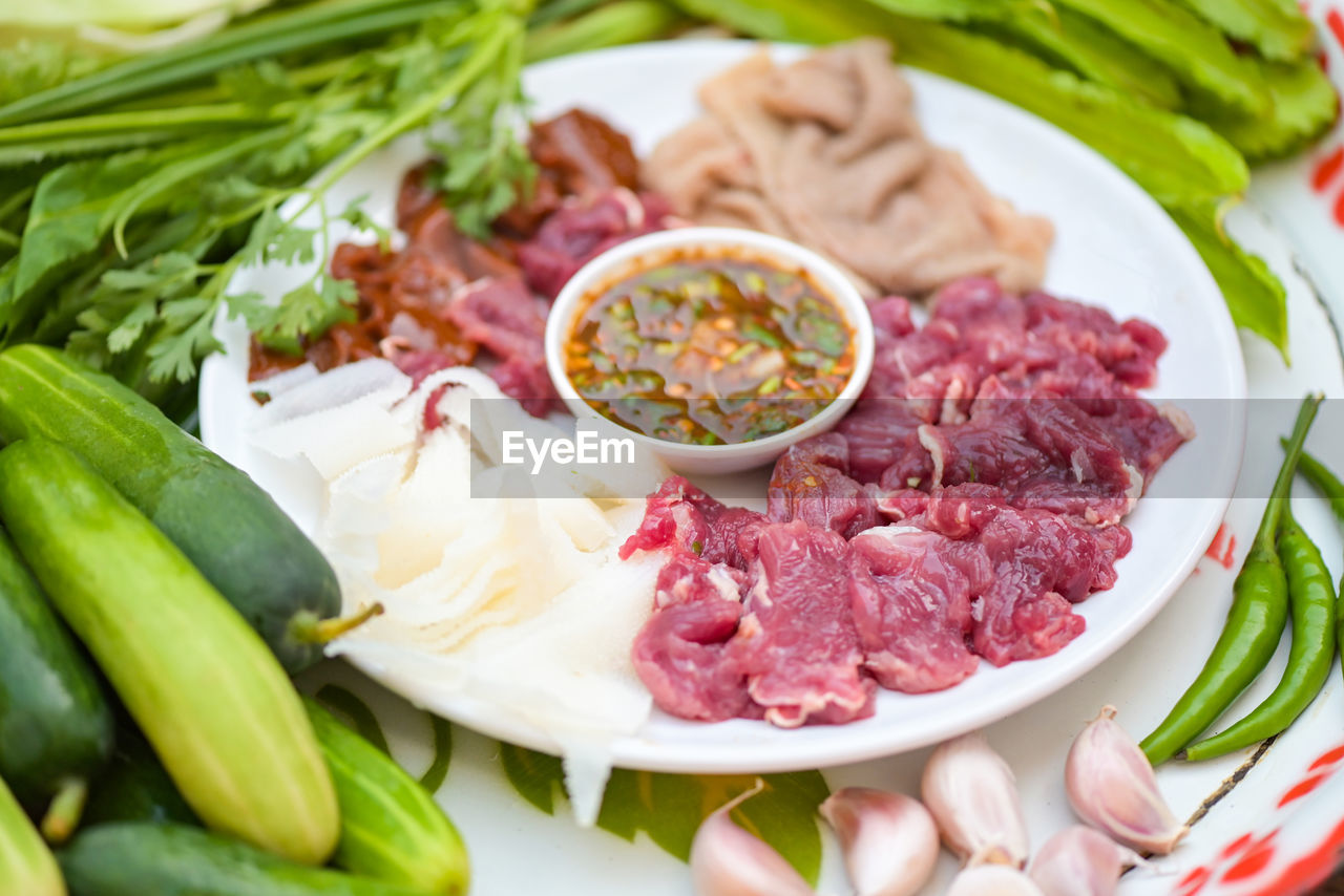 food, food and drink, vegetable, meat, freshness, healthy eating, dish, plate, cuisine, wellbeing, meal, spice, herb, ingredient, no people, onion, raw food, pork, cucumber, tomato, red meat, variation, green, root vegetable, plant, fruit, indoors, bowl, gourmet, dinner, beef, salad, slice, close-up, crockery, produce, condiment, appetizer
