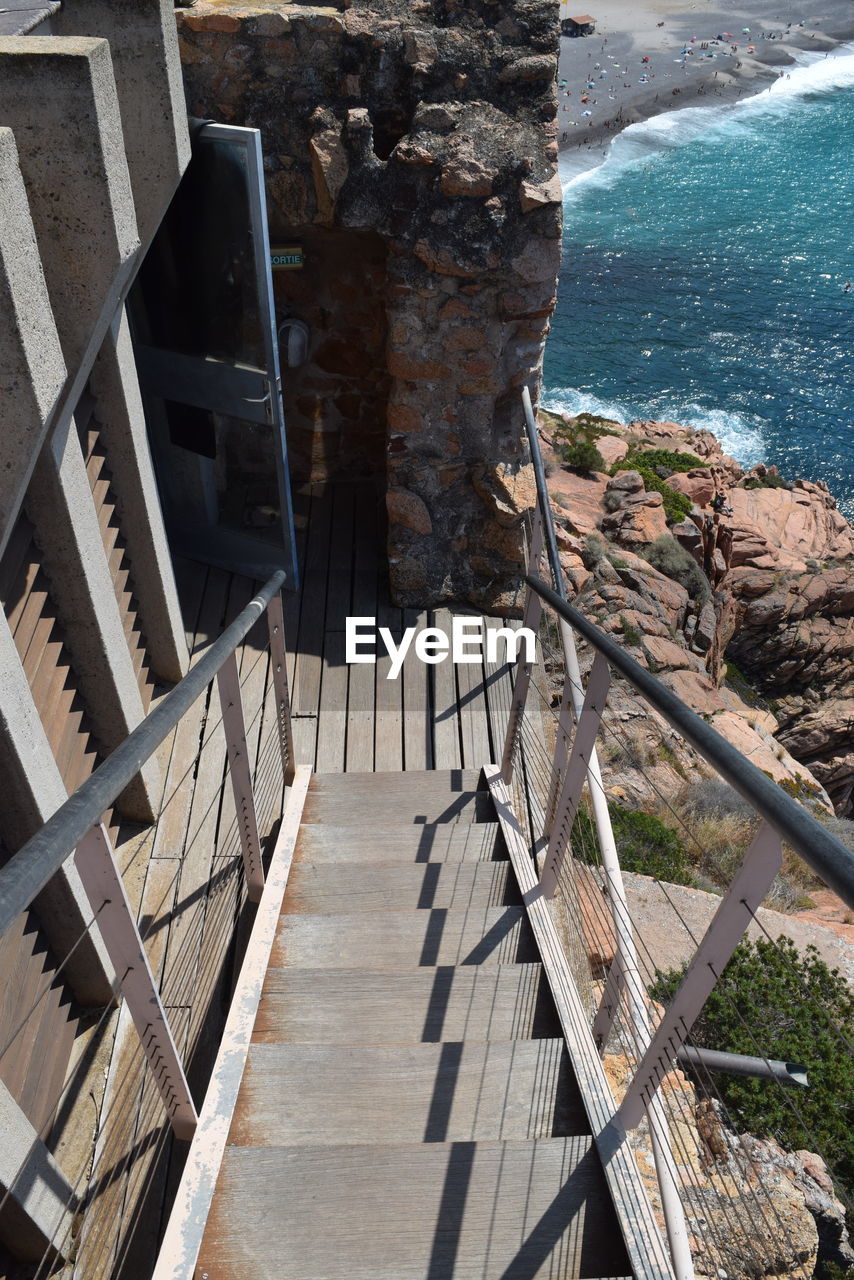 High angle view of staircase by sea