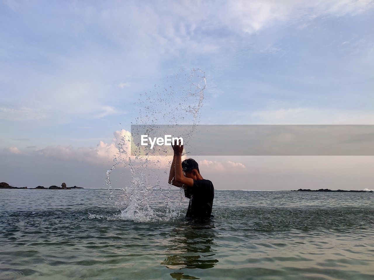 water, sky, sea, one person, nature, ocean, cloud, holiday, splashing, shore, wave, adult, beach, vacation, trip, leisure activity, motion, men, beauty in nature, lifestyles, outdoors, swimming, day, horizon over water, enjoyment, arm, land, fun, child, sports, happiness, horizon, coast, childhood, wind wave, summer, limb, arms raised, standing, emotion, blue, scenics - nature, person, three quarter length