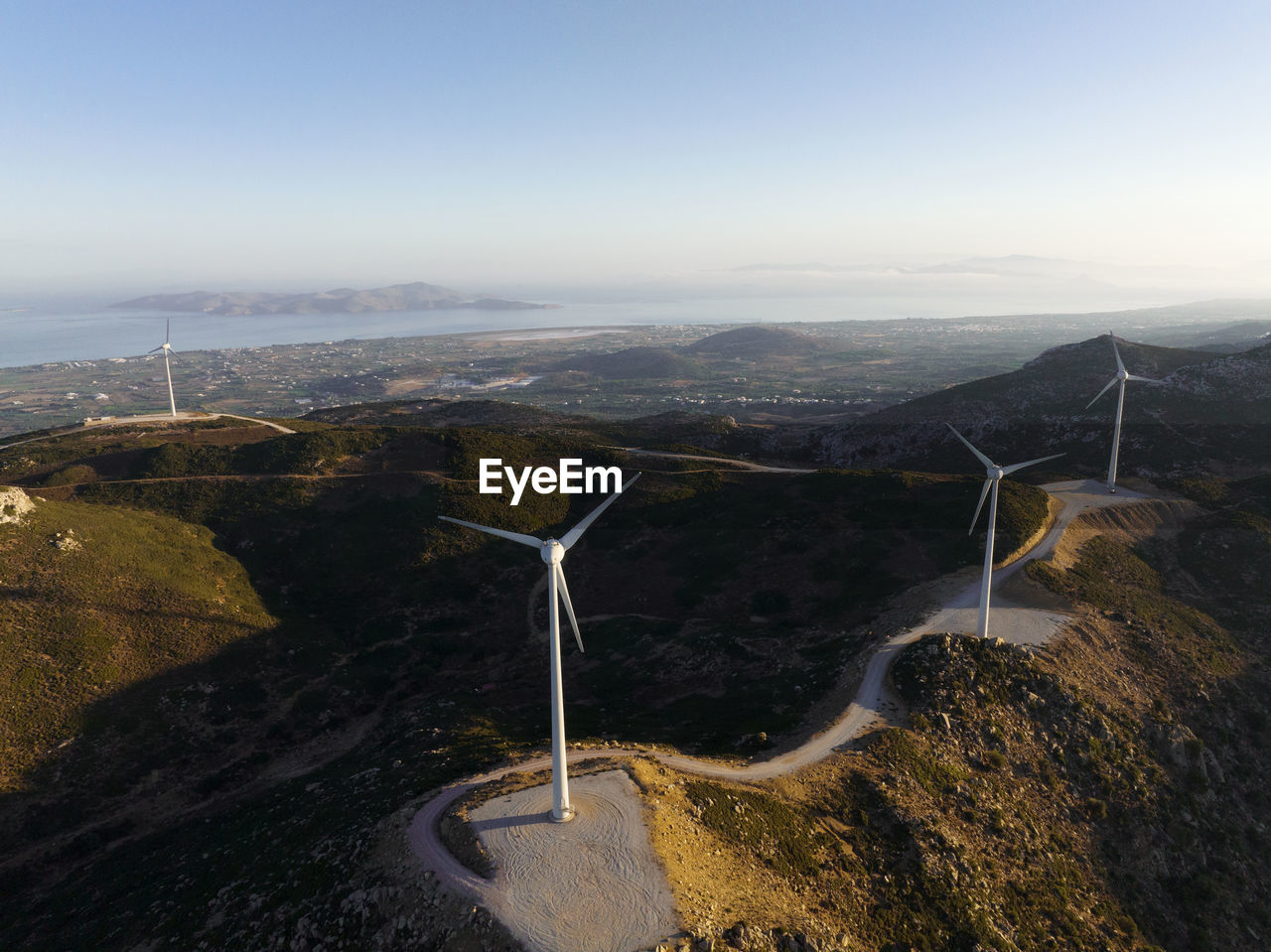 Greece, aegean, kos, wind farm turbines at dawn