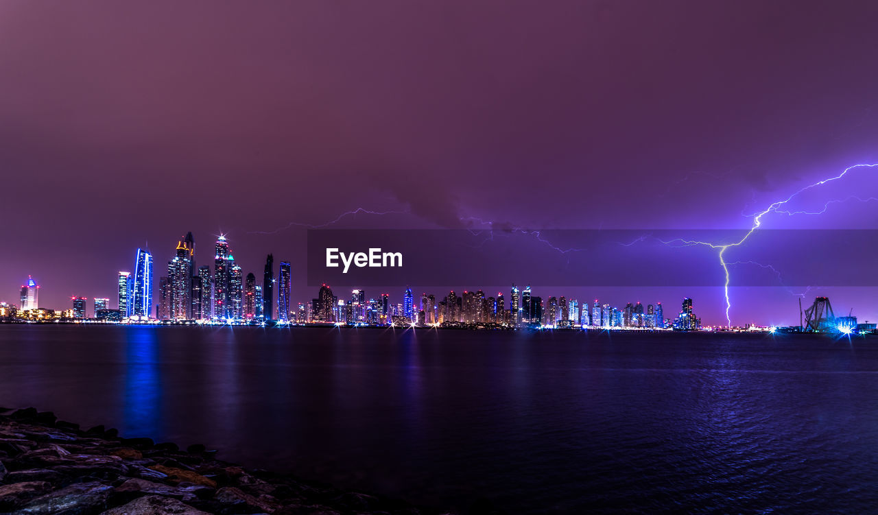 View of illuminated dubai city at night in storm