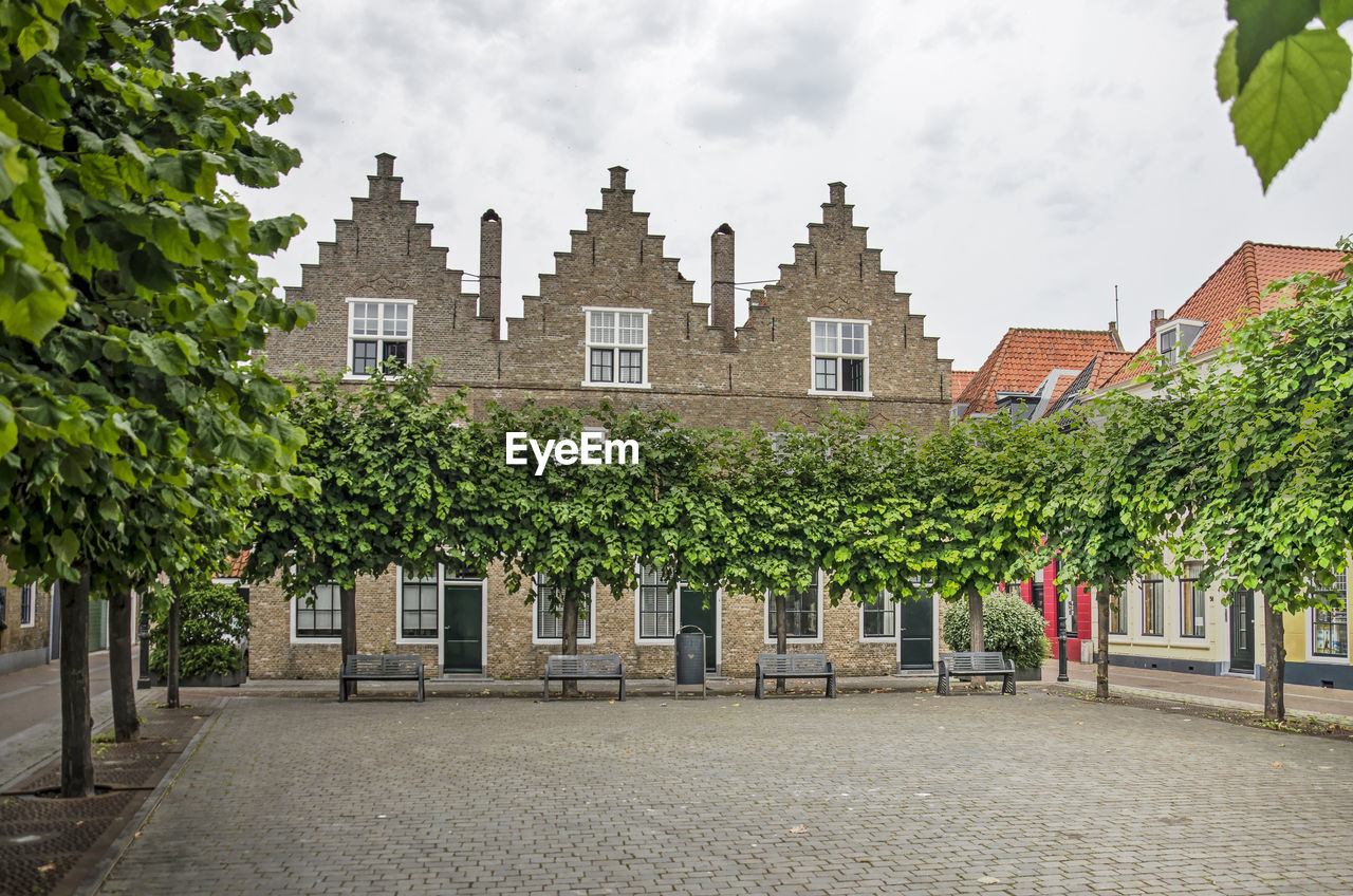 Square with trees and facades in vlissingen