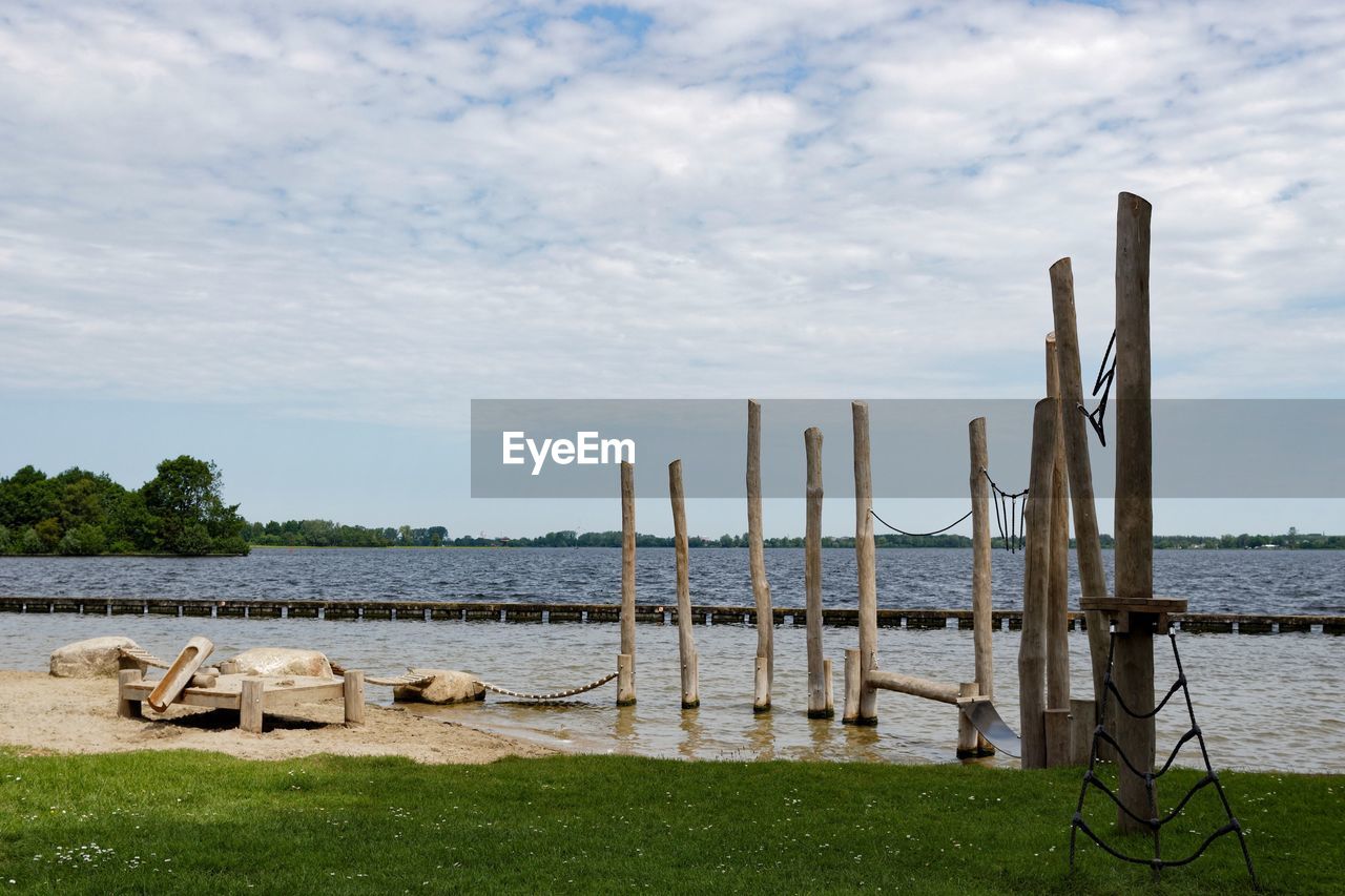 Wooden post in river