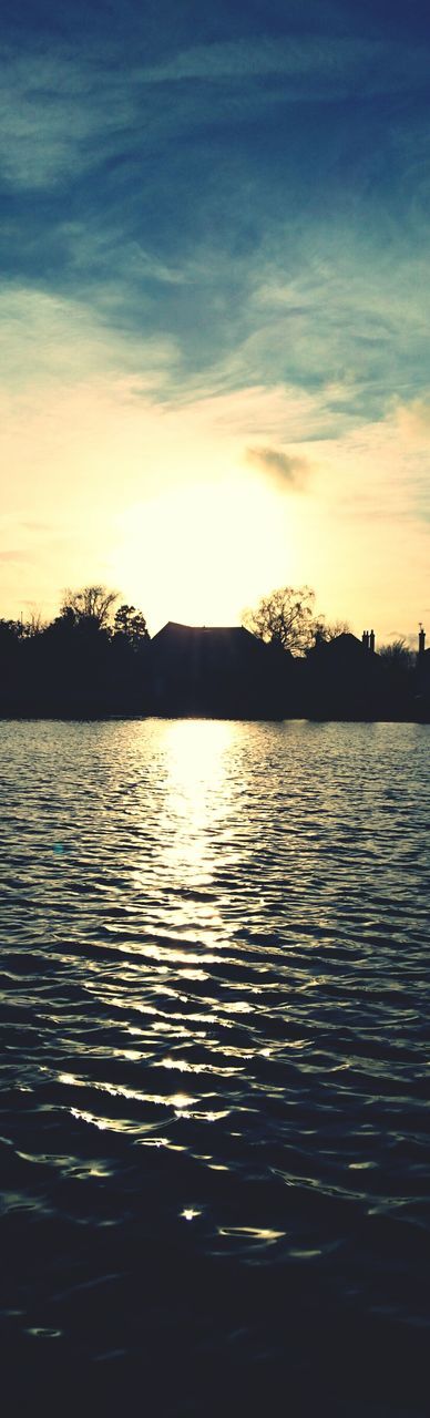 SCENIC VIEW OF LAKE AT SUNSET