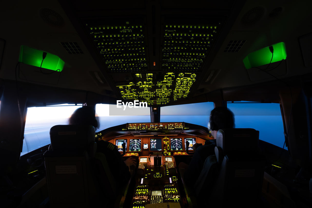 VIEW OF AIRPLANE THROUGH WINDOW