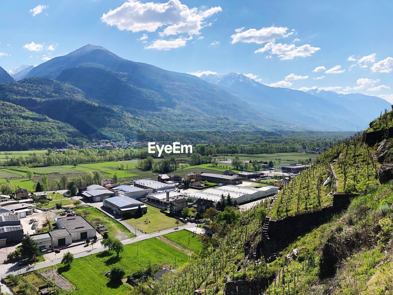 High angle view of buildings and mountains against sky