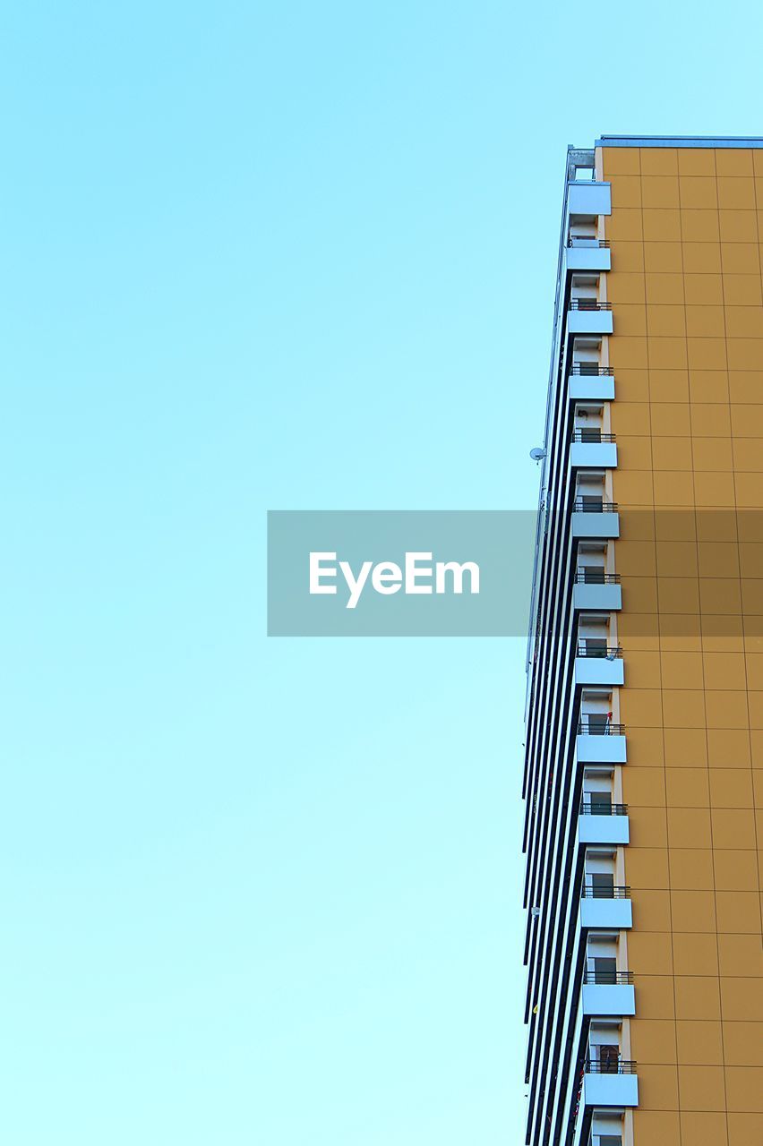 LOW ANGLE VIEW OF TELEPHONE POLE AGAINST CLEAR BLUE SKY