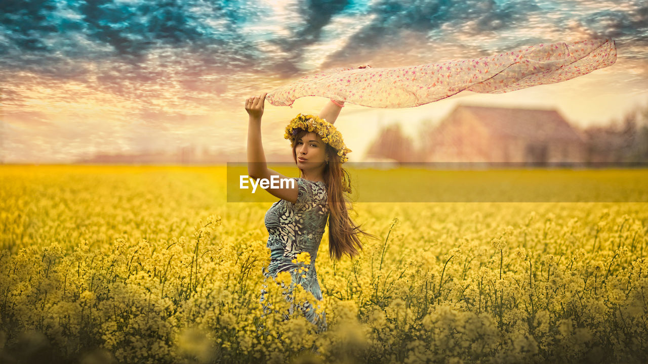 WOMAN STANDING IN FIELD