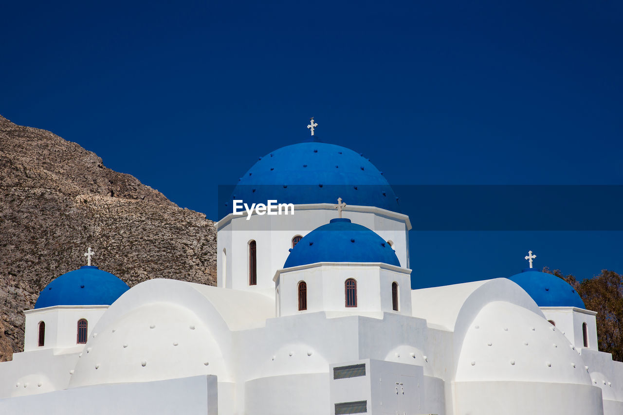 The church of holy cross in the central square of perissa on santorini island