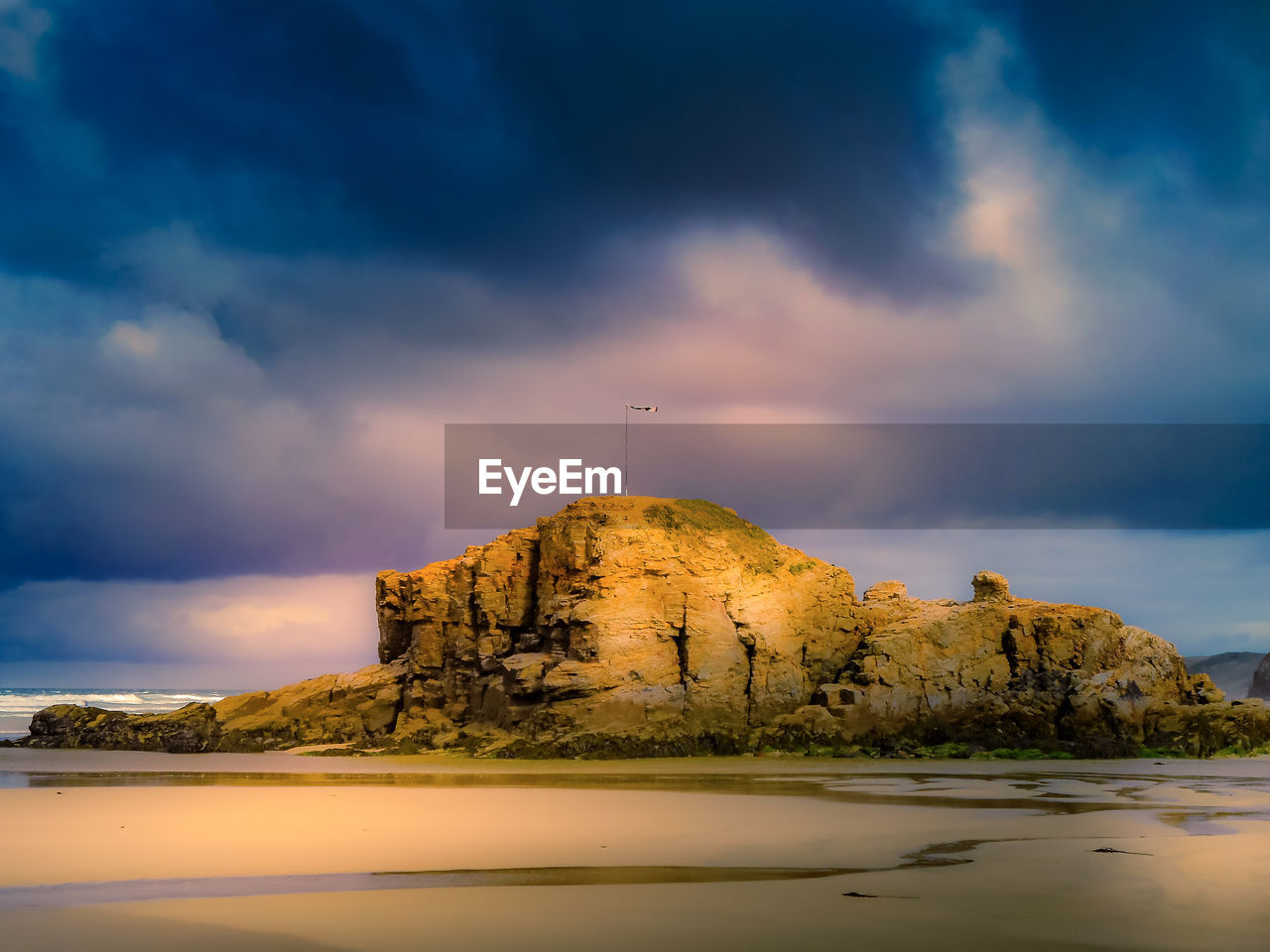 SCENIC VIEW OF ROCKS AGAINST SKY