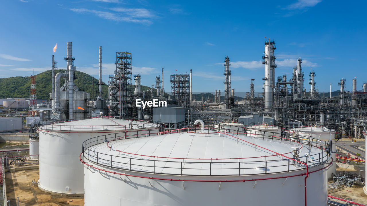 Oil and gas refinery petrochemical plant industrial with oil and gas storage tank, white oil and gas