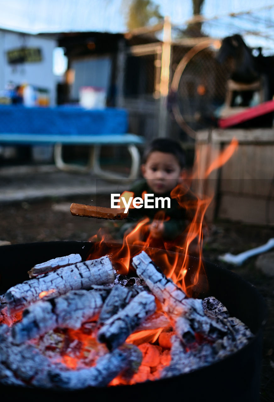 Young man preparing food on barbecue grill