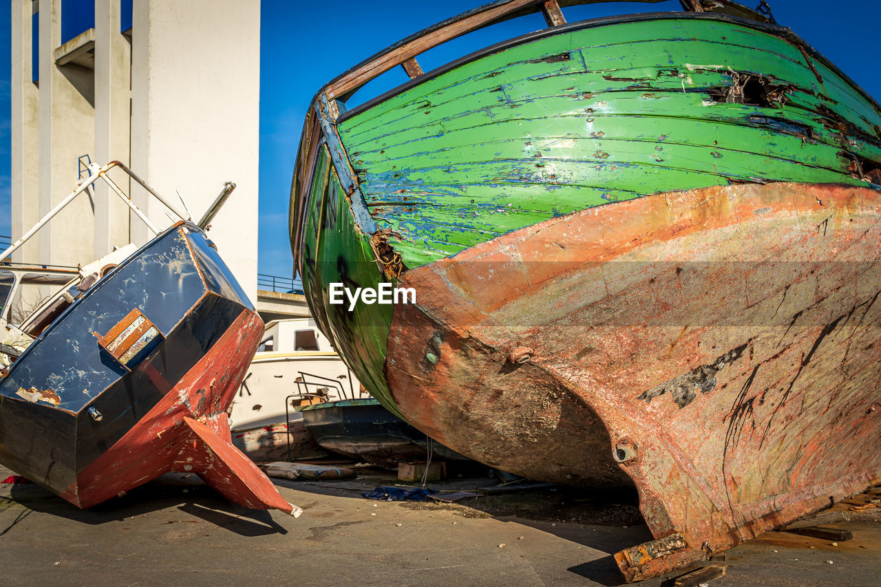 Close-up of abandoned boat moored