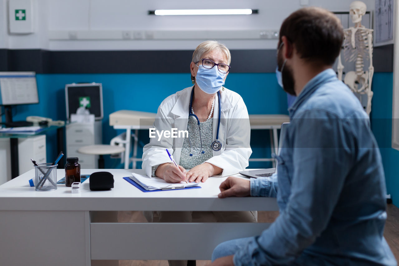 Portrait of female doctor working in office