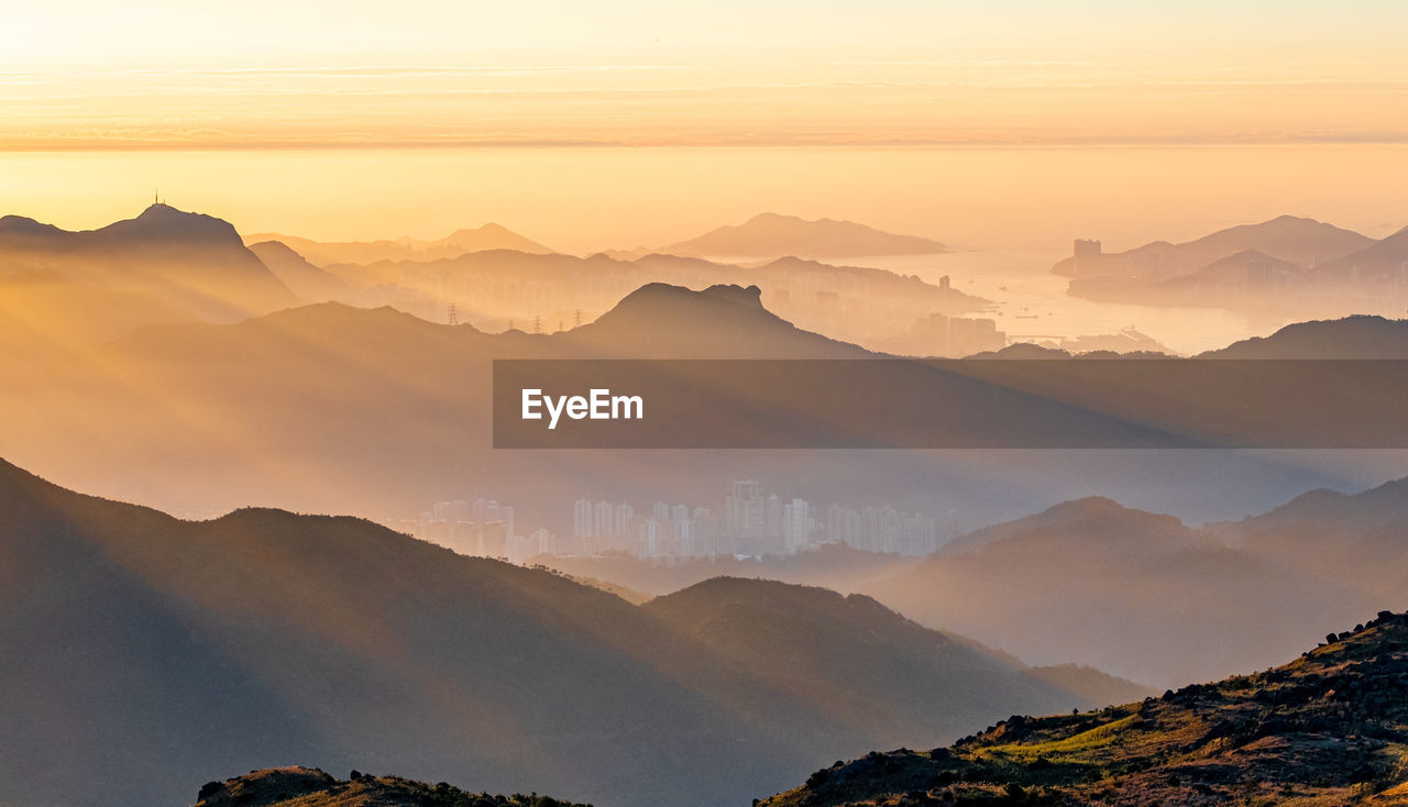 Scenic view of mountains against sky during sunset