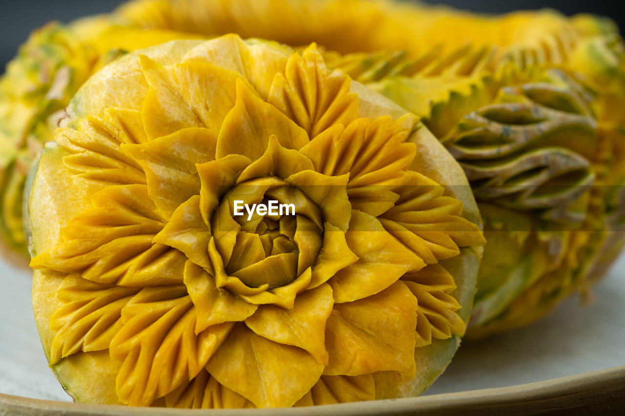 CLOSE-UP OF YELLOW ROSE FLOWER IN CONTAINER