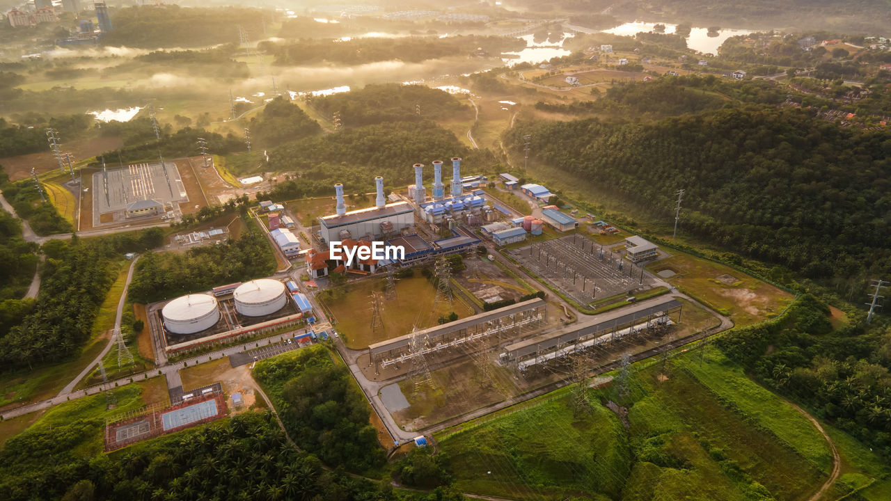 Aerial view of a gas turbine power plant station during sunrise.