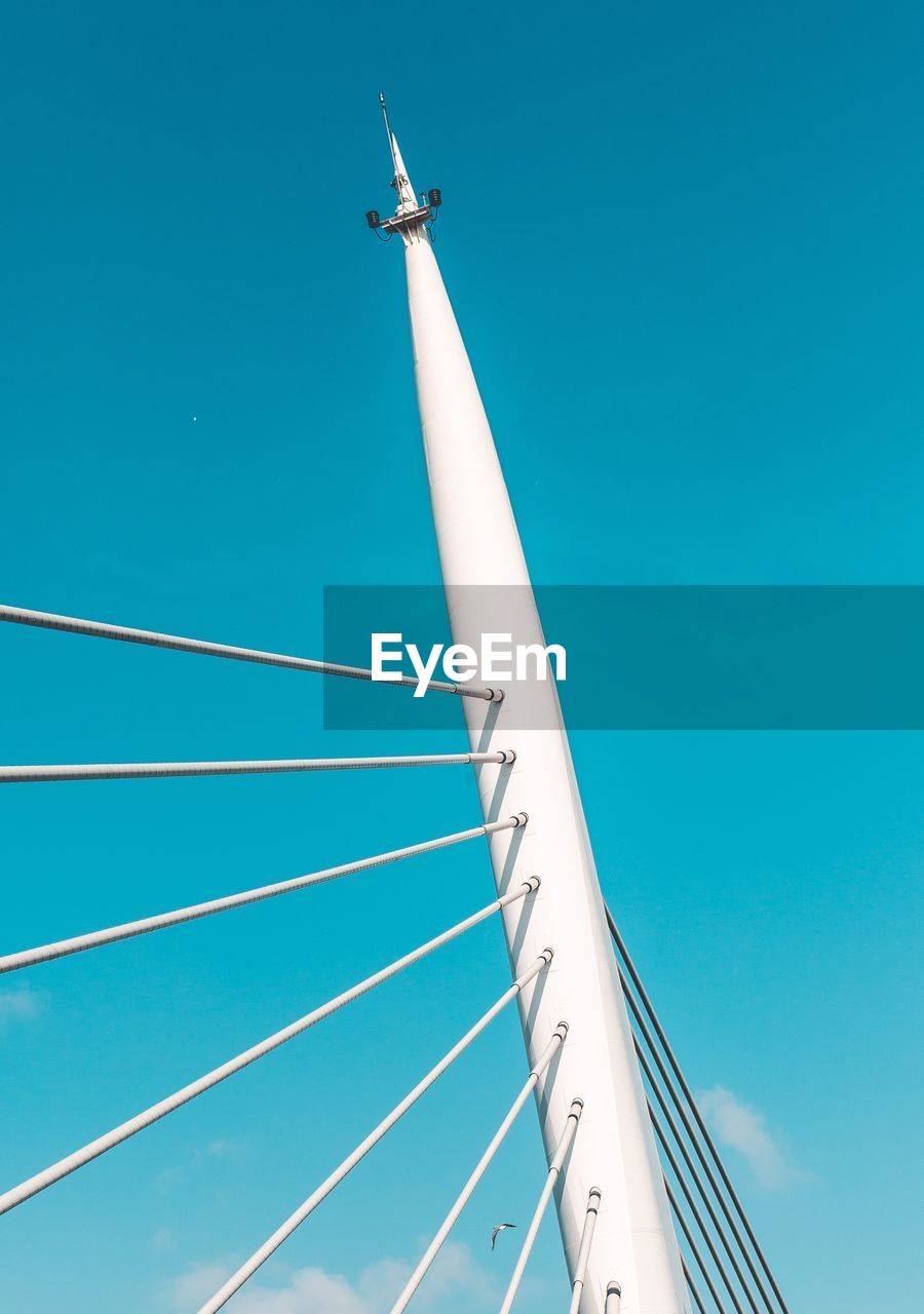 LOW ANGLE VIEW OF CABLES AGAINST CLEAR BLUE SKY