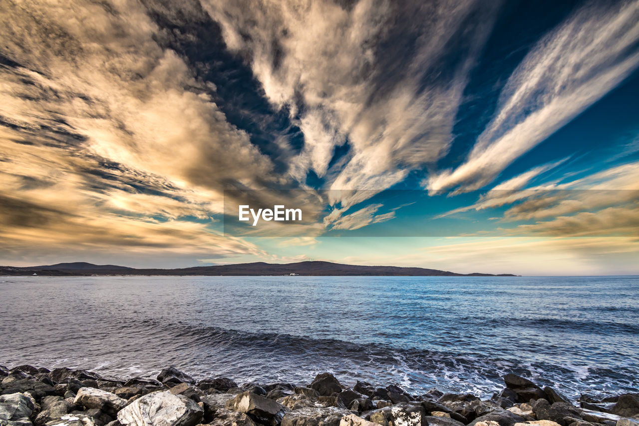 Scenic view of sea against sky during sunset