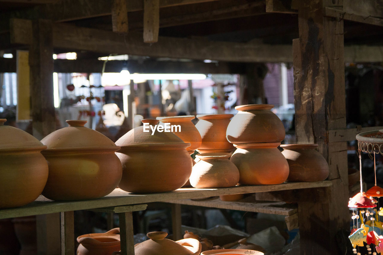 Various clay pots for sale at market stall