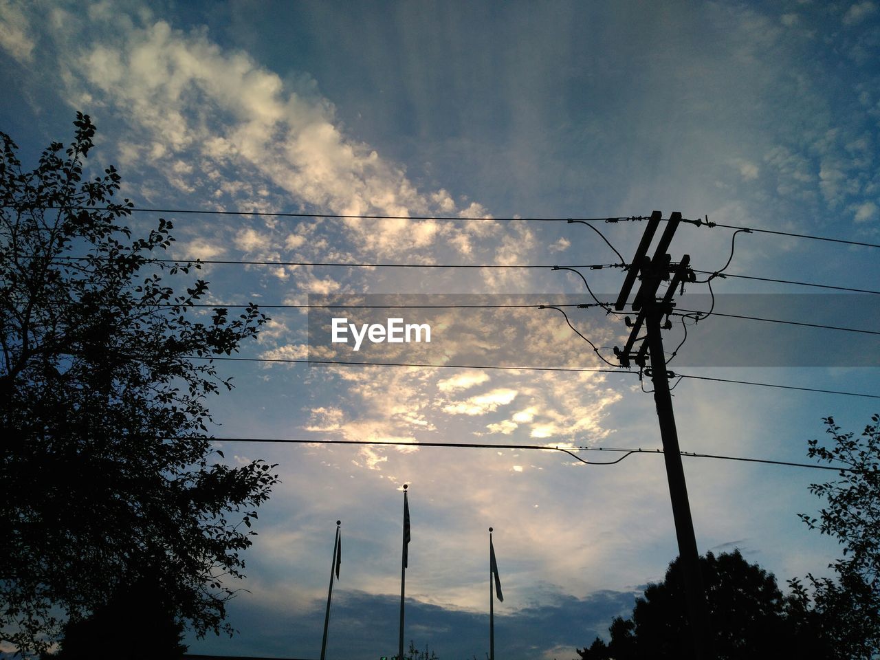 LOW ANGLE VIEW OF SILHOUETTE ELECTRICITY PYLON