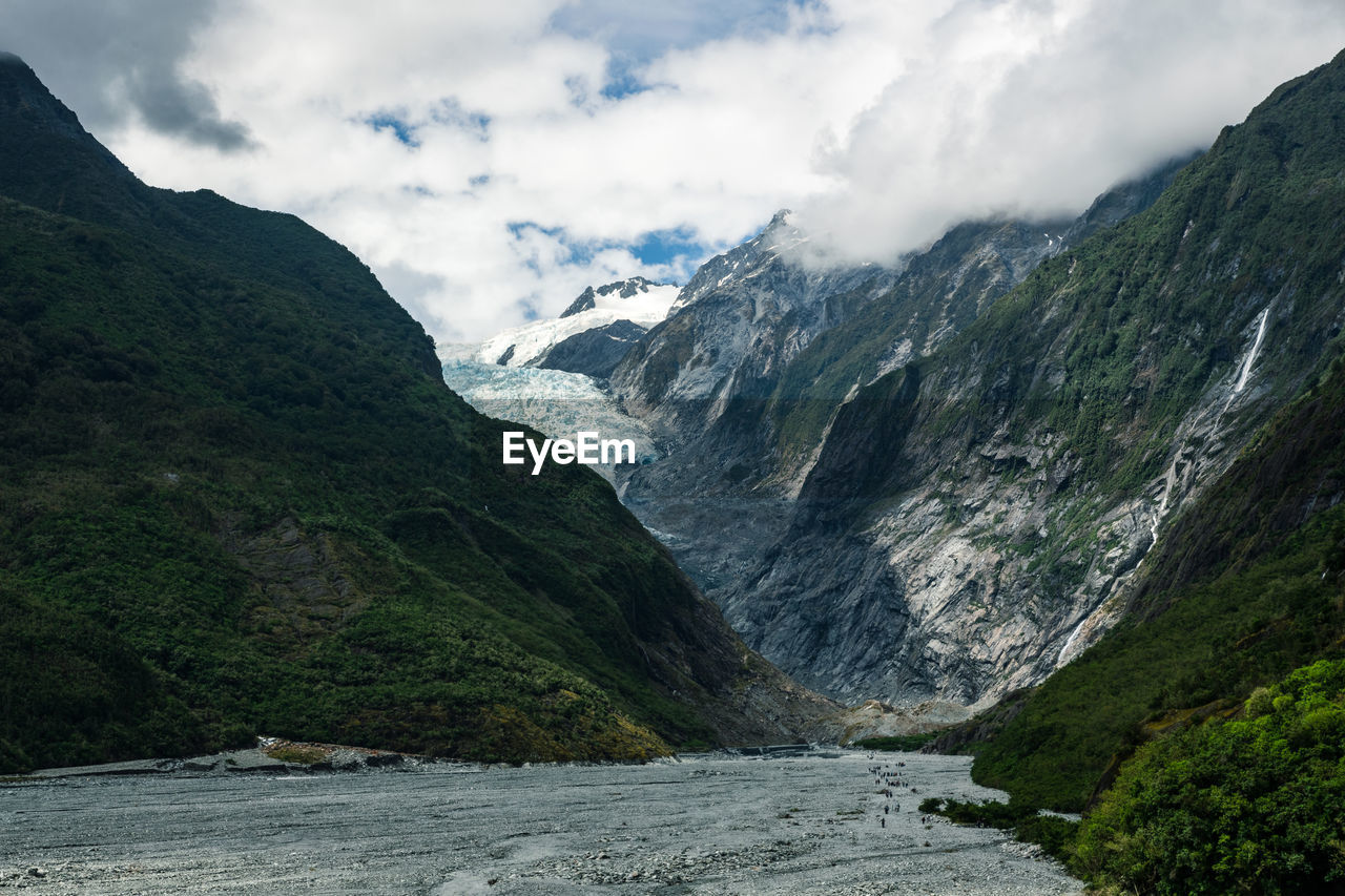 Scenic view of mountains against sky at franz josef glacier new zealand