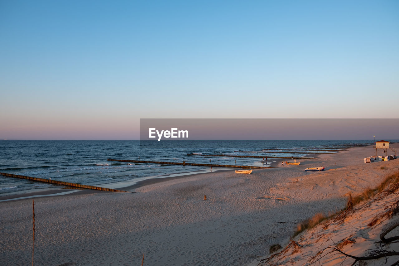 SCENIC VIEW OF BEACH AGAINST CLEAR SKY