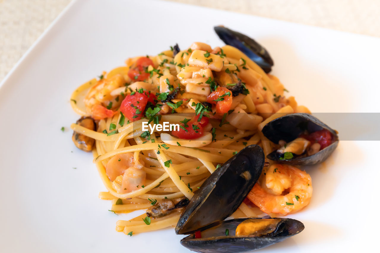 High angle view of pasta in plate on table