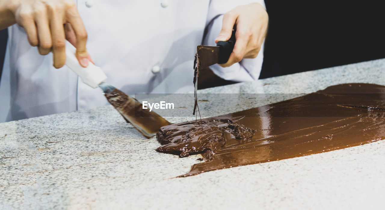 cropped image of man working on table