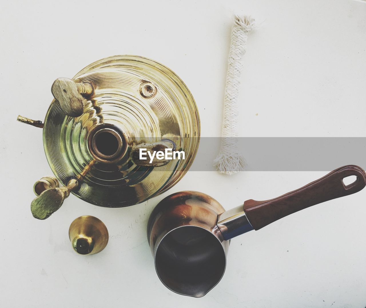 Directly above view of stove and container against white background