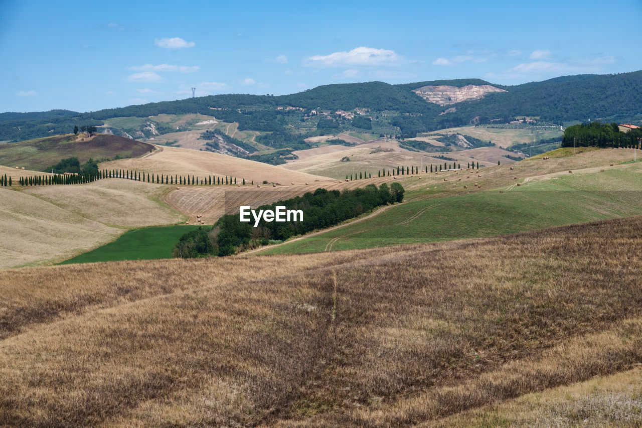 scenic view of landscape and mountains against sky