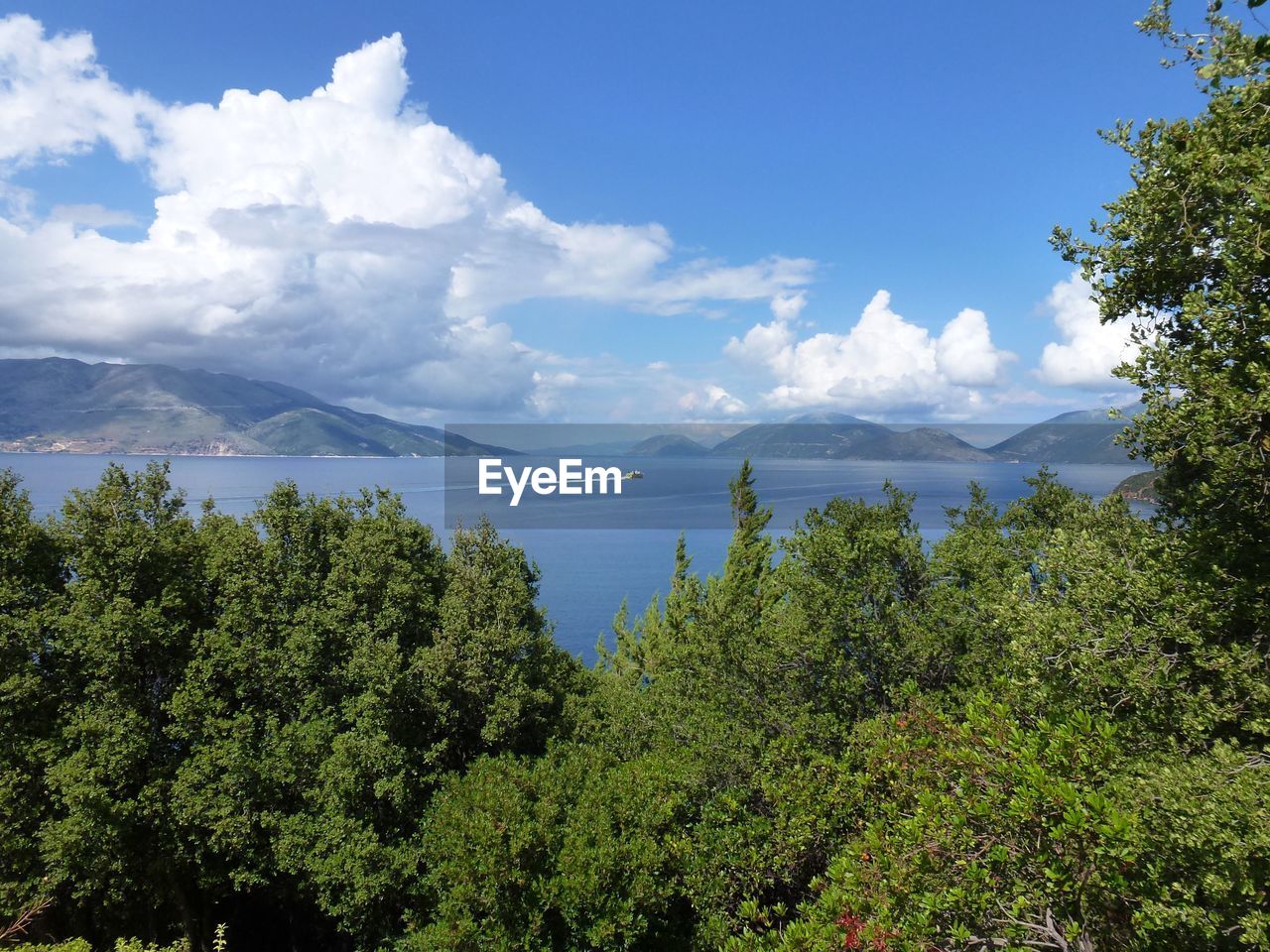 Scenic view of lake against cloudy sky