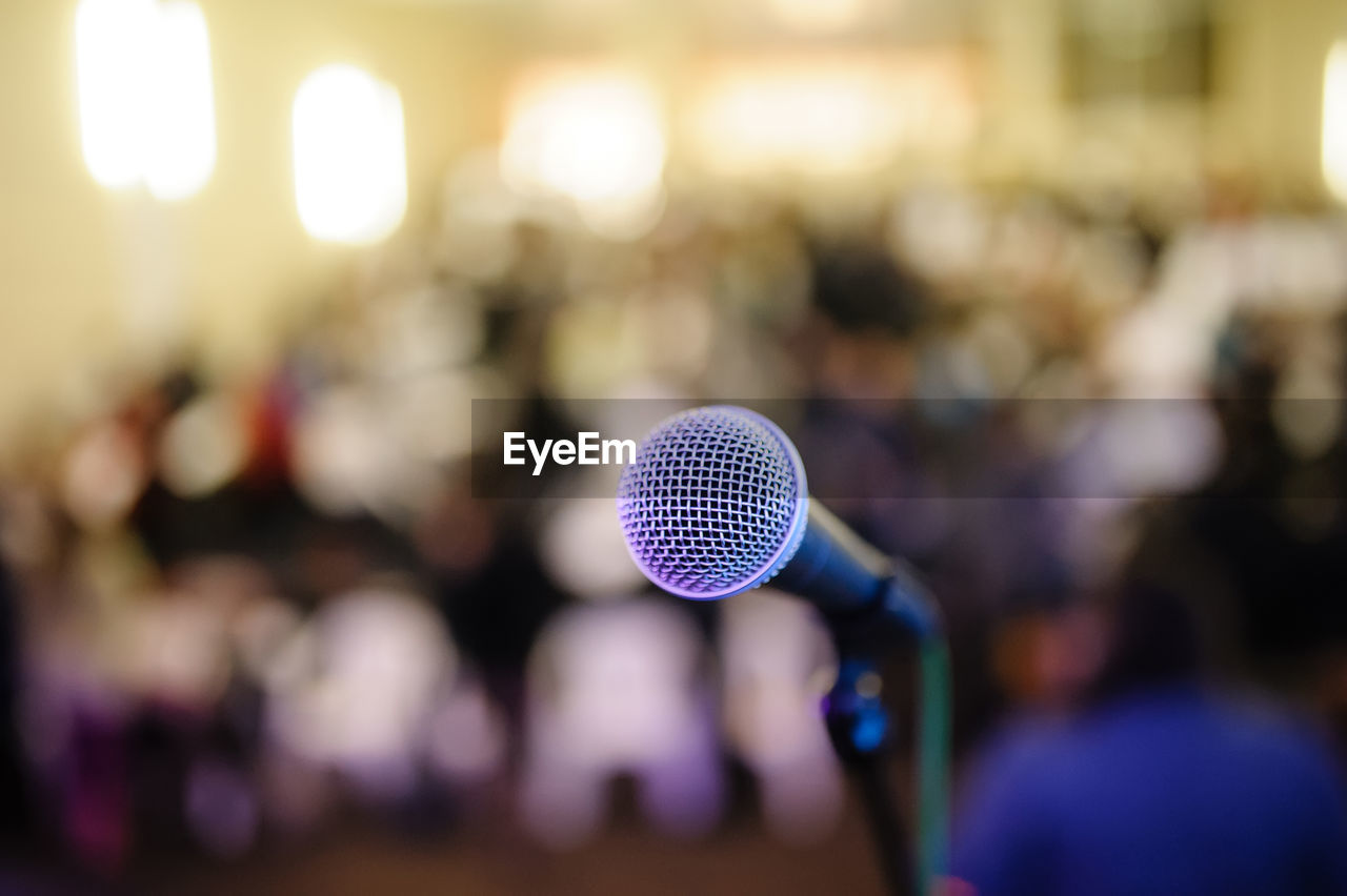 Close-up of microphone in auditorium