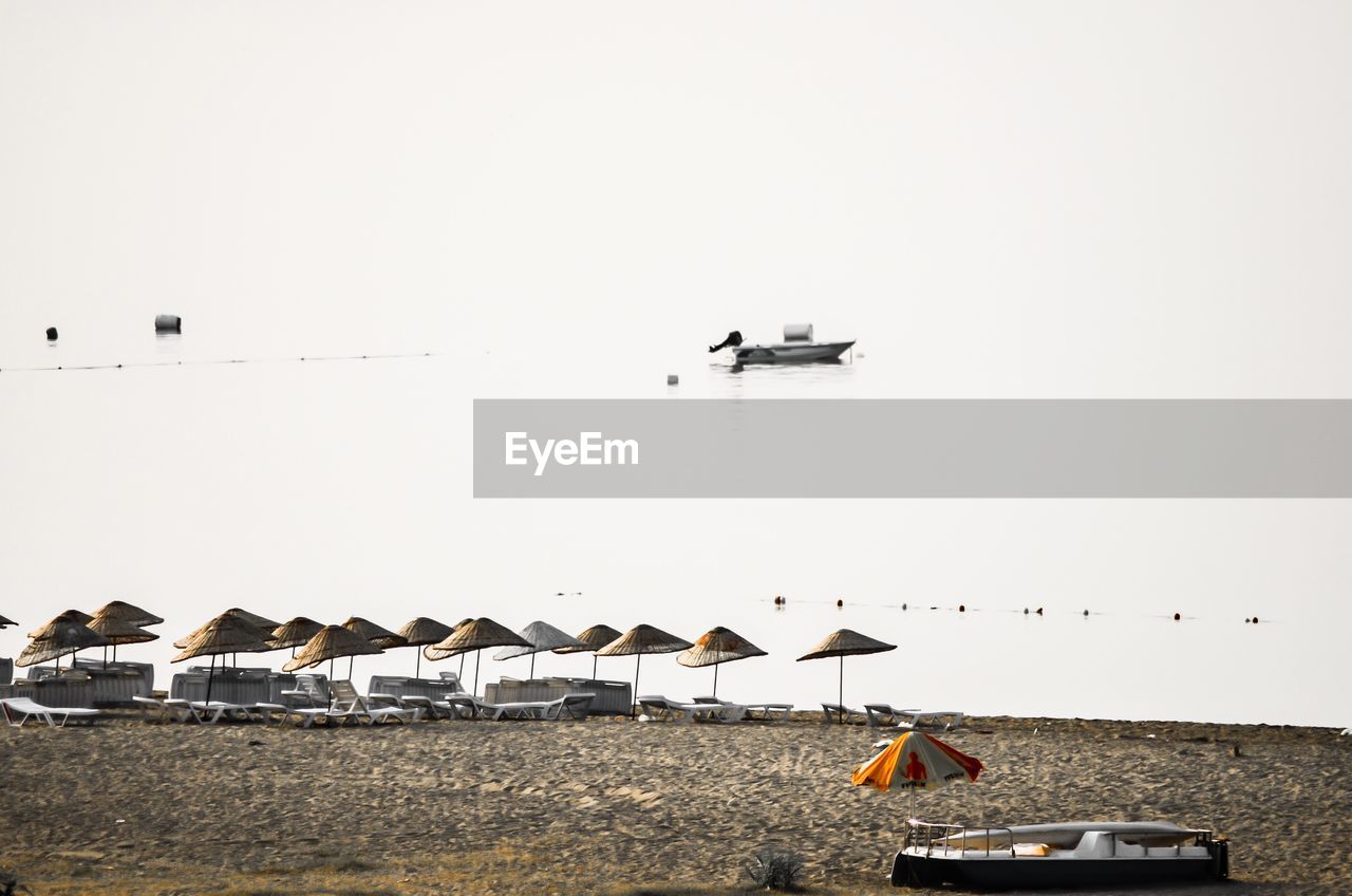 View of beach against clear sky